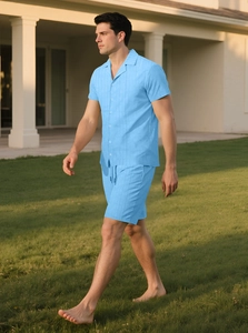 Detail of light blue short sleeve button shirt and shorts set with knit texture
