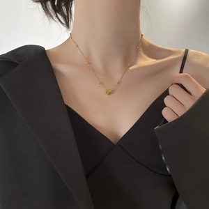 Elegant gold puff heart pendant necklace with fine beaded chain for a modern minimalist look