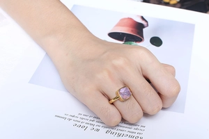 Detailed view of square pink gemstone set in a minimalist gold stainless steel ring