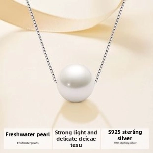Detail of single round freshwater pearl pendant on a S925 sterling silver box chain