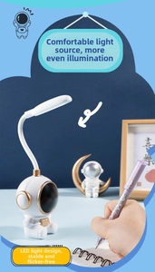 Close-up of flexible neck LED desk lamp with astronaut base and soft light emission