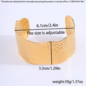 Detail view of gold leaf cuff bracelet with measurements and hammered texture finish