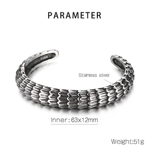 Detail of retro punk dragon scale bangle showing internal dimensions 63x12mm and 51g weight