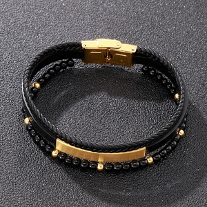 Detail of multi-layer men's leather bracelet with gold stainless steel folding clasp