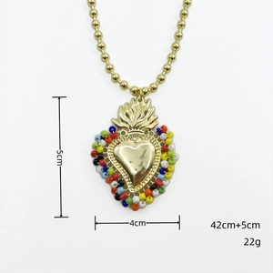 Detail shot showing 5cm flaming heart pendant with colorful beads and dimensions