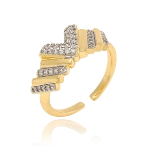 Detailed view of golden wavy open ring with sparkling white cubic zirconia stones