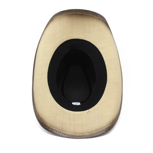 Detailed bottom view of straw cowboy hat showing woven brim and black inner sweatband