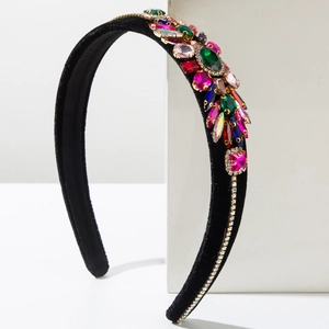 Macro detail of velvet headband with colorful geometric crystals and rhinestone lines