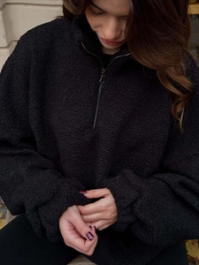 Women's warm black sherpa fleece half-zip jacket with a high collar and casual loose fit
