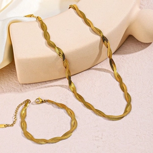 18K gold plated twisted snake chain necklace and bracelet set on silk background