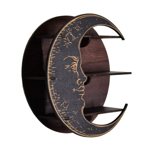 Macro shot of 3-tier dark brown wooden crescent moon shelf with engraved celestial face