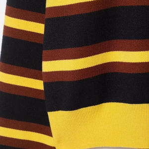 Women's striped knit polo shirt with brown, yellow, and black wide horizontal stripes