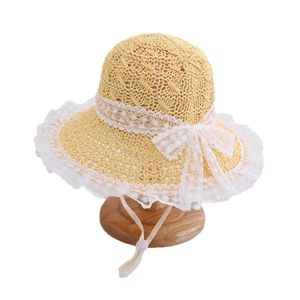 Girl's summer straw sun hat featuring elegant white lace edges and a large bow detail