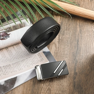 Men's black leather belt with automatic buckle on a stylish wood desktop scene