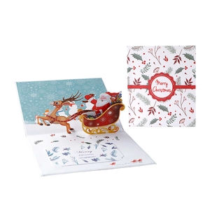 Biglietto di Natale 3D pop-up con Babbo Natale sulla slitta e scritte augurali
