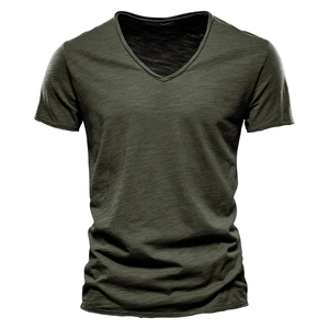 Detail view of the deep green slub cotton texture on a premium V-neck short sleeve T-shirt