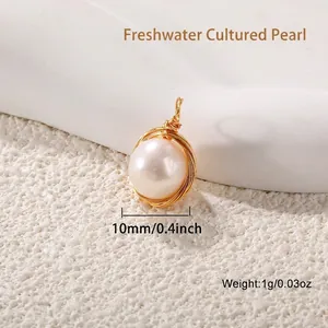 Macro shot of 10mm freshwater pearl pendant with handcrafted gold wire wrapping detail