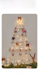 Detail of silver LED ribbon lights with wooden reindeer ornaments for Xmas tree decor