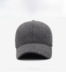 Front view of a minimalist dark grey wool baseball cap with thermal ear protection