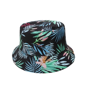 Tropical banana leaf print bucket hat in black with vibrant multi-color summer foliage