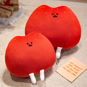 Cute strawberry plush toy pillow set in two sizes with adorable faces on beige carpet