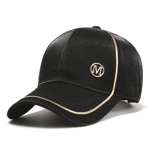 Women's black satin baseball cap with gold M logo and metallic piping detail
