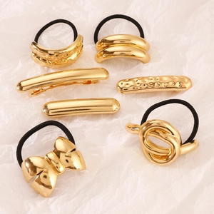 Set of 7 vintage golden alloy hair ties and clips with minimalist geometric patterns