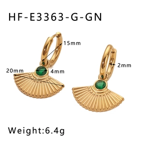 Detail view of gold fan-shaped earrings with green zircon and 20mm width dimensions