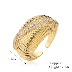 Detail view of gold open ring with micro-pave zircons and 1.5cm width texture