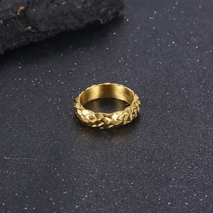 Macro shot of 6mm golden stainless steel ring featuring 3D snake scale texture details
