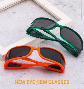 Macro detail of TB124 sports polarized sunglasses in bright orange and dark green frame