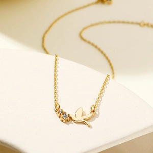 18K gold plated stainless steel bird pendant necklace with white cubic zirconia stones