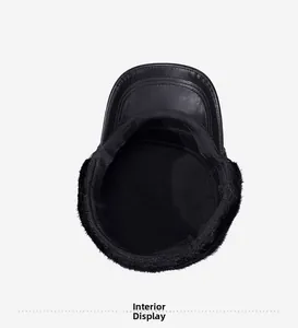 Detail view of the warm plush lining and ear flaps inside a black faux leather winter hat