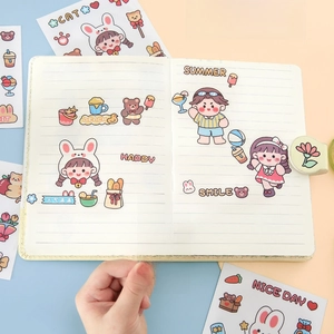 Cute cartoon PVC stickers with bunny and bear designs on a notebook page for scrapbooking
