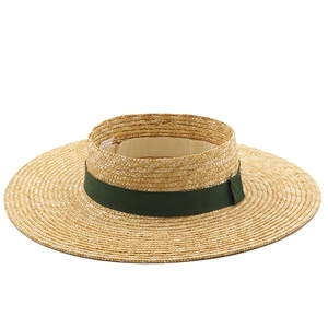 Classic straw boater hat with wide brim and dark green ribbon for summer beach sun protection
