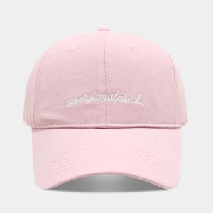 Pink cotton baseball cap featuring white overstimulated embroidery with a curved brim