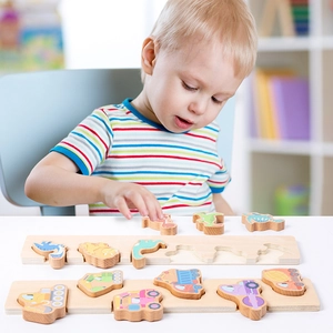 Wooden puzzle blocks with dinosaur and construction vehicle themes for toddlers