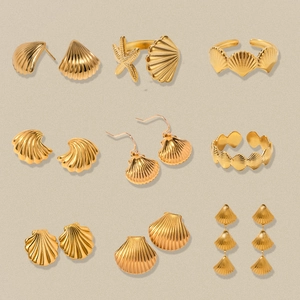 Gold stainless steel ocean-themed jewelry set featuring starfish and seashell designs