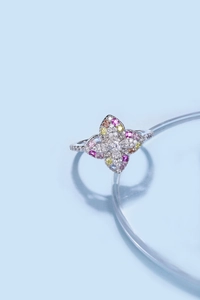 Detailed macro view of S925 silver ring featuring colorful zircon stones in a floral design