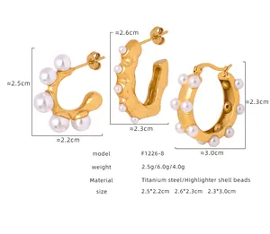 Detailed size chart for titanium steel gold earrings featuring lustrous shell pearls