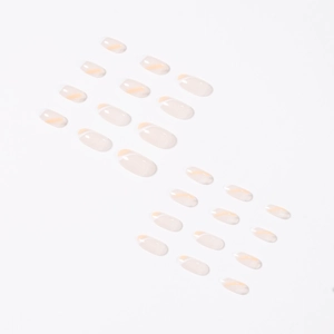 French white and orange press-on nails with minimalist curved lines in jelly finish