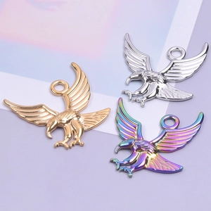 Detailed view of metal eagle pendants in gold, silver, and rainbow colors for DIY jewelry
