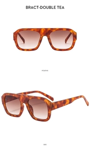 Detail view of retro tortoise-shell aviator sunglasses with gradient brown lenses