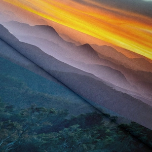 Detailed fabric texture of Bohemian sunset mountain tapestry with soft pleats