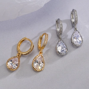 Elegant gold and silver teardrop earrings with sparkling zircon stones in a pair