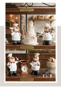 Detail of creative resin chef figurines holding cakes on a dark wood bakery shelf