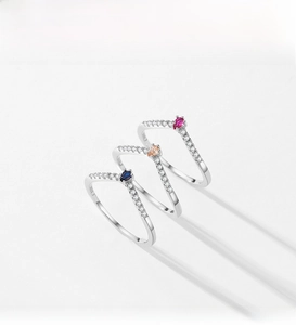 Detailed view of three V-shaped S925 silver rings with colorful pear-cut zircon stones