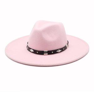 Macro detail of pink wool fedora hat with black leather band and silver metal studs