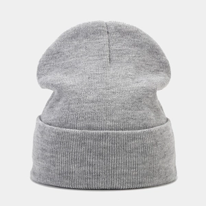 Close-up of heather gray knitted beanie showing high-quality fine texture and ribbed cuff