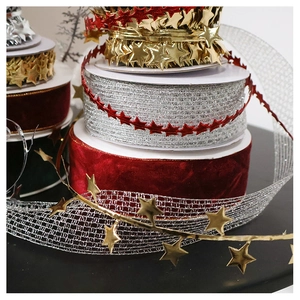 Stacked Christmas velvet ribbons and gold star garlands for DIY wreath decorating